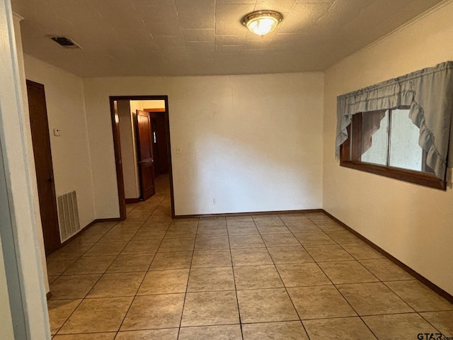 view of tiled spare room