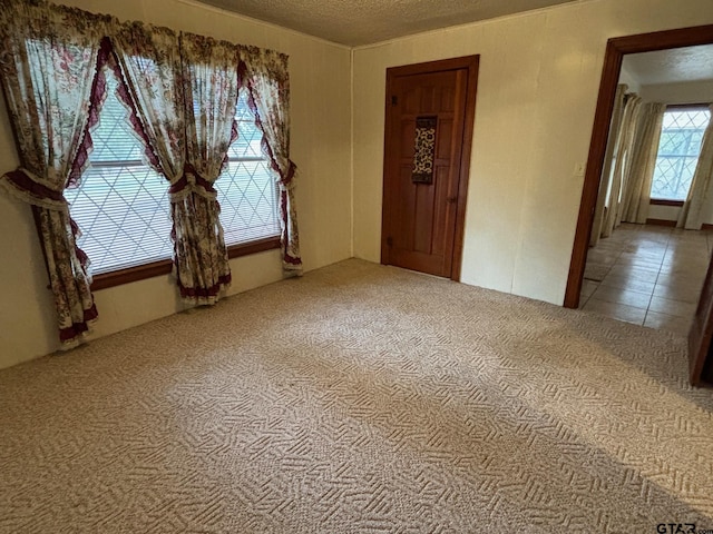 empty room with a textured ceiling