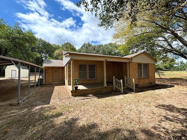 rear view of house with an outbuilding