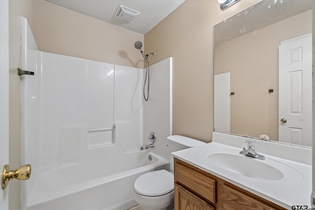 full bathroom with vanity, shower / bathing tub combination, a textured ceiling, and toilet