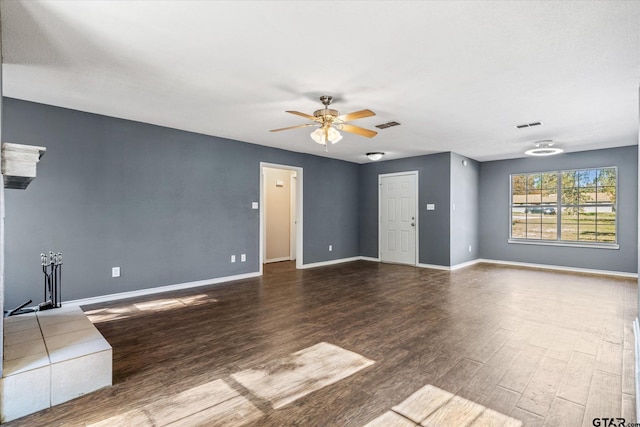 spare room featuring dark hardwood / wood-style floors and ceiling fan