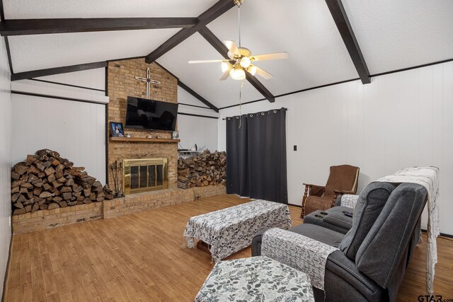 9961 Creek Bend Dr, Tyler, TX 75707 - living room featuring a ceiling fan, wood finished floors, and a brick fireplace