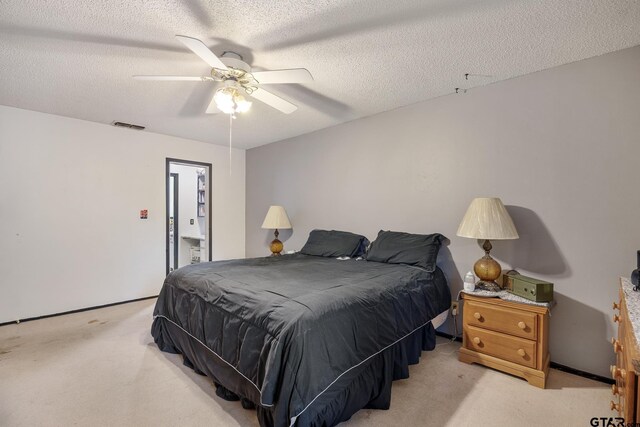 9961 Creek Bend Dr, Tyler, TX 75707 - bedroom featuring light colored carpet, a textured ceiling, and a ceiling fan