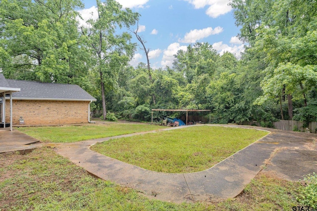 9961 Creek Bend Dr, Tyler, TX 75707 - view of yard with a detached carport