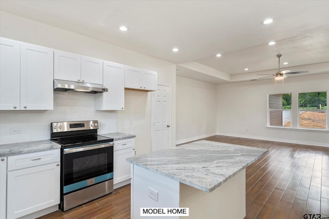 kitchen with white cabinetry, dark wood-type flooring, and electric range