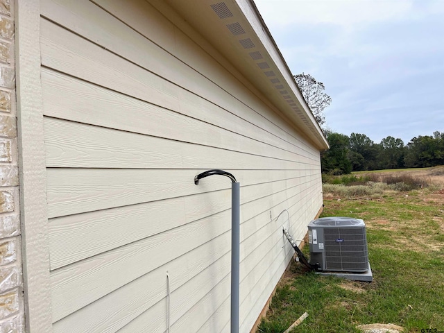 view of side of property with cooling unit