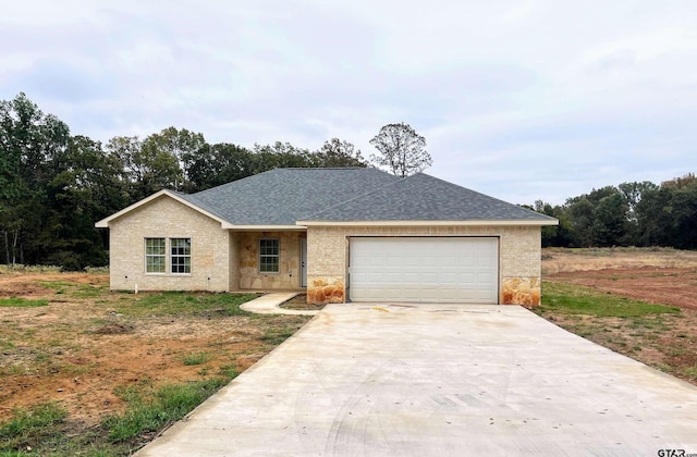 single story home featuring a garage