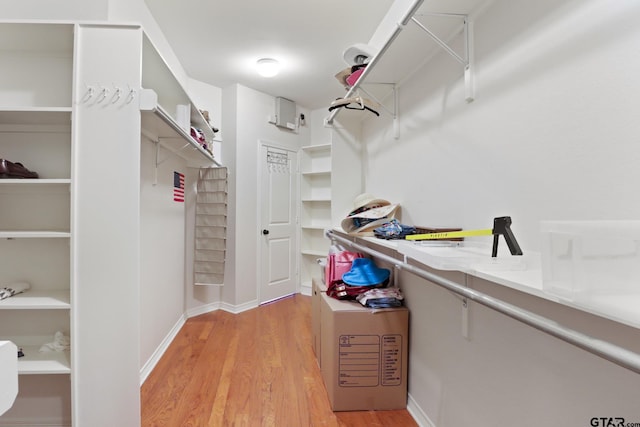 walk in closet featuring light hardwood / wood-style floors