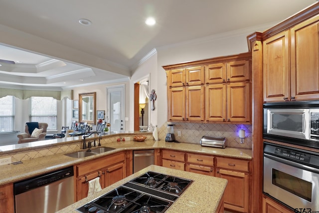 kitchen featuring ornamental molding, stainless steel appliances, sink, and decorative backsplash