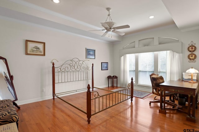 bedroom featuring hardwood / wood-style flooring and ornamental molding