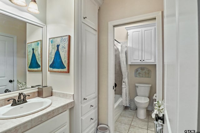 full bathroom featuring shower / tub combo with curtain, vanity, tile patterned floors, and toilet