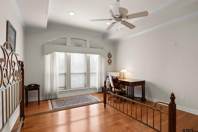 dining area featuring crown molding, ceiling fan, and hardwood / wood-style flooring