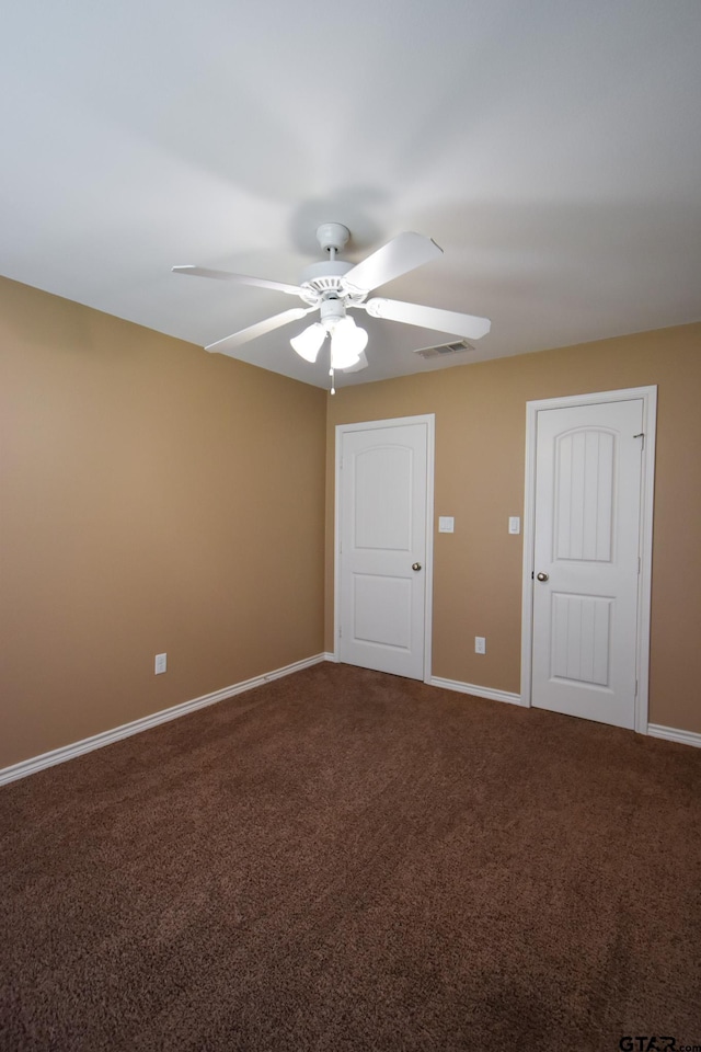 carpeted empty room with ceiling fan