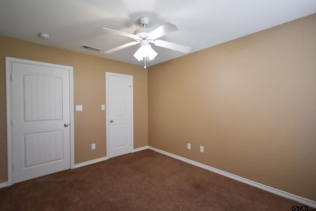 unfurnished bedroom featuring carpet and ceiling fan