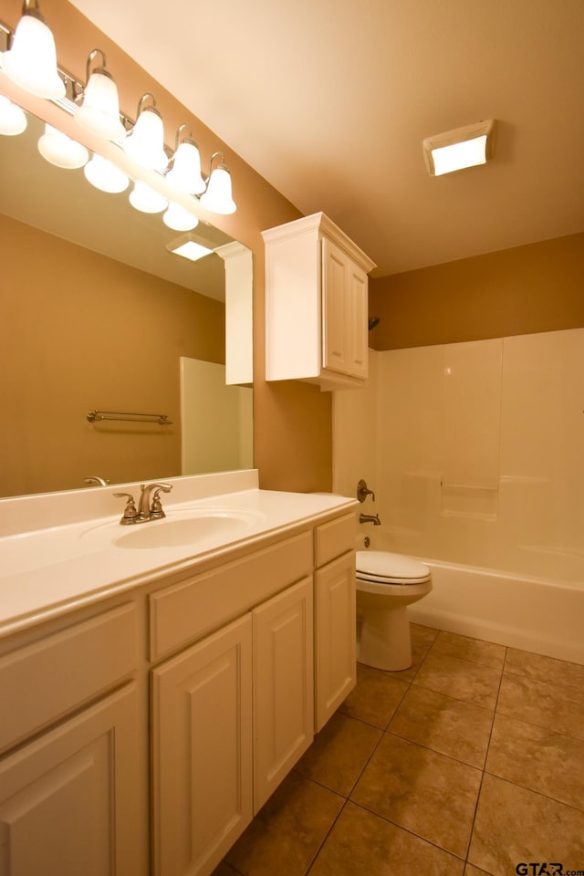 full bathroom featuring vanity, tub / shower combination, tile patterned flooring, and toilet