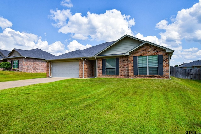 view of front of home featuring a garage and a front yard