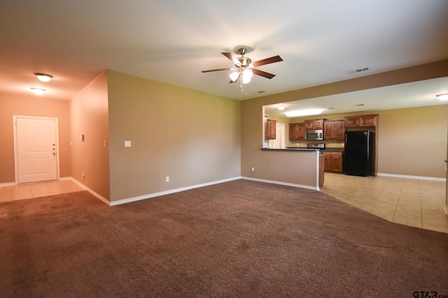 unfurnished living room with ceiling fan and light colored carpet