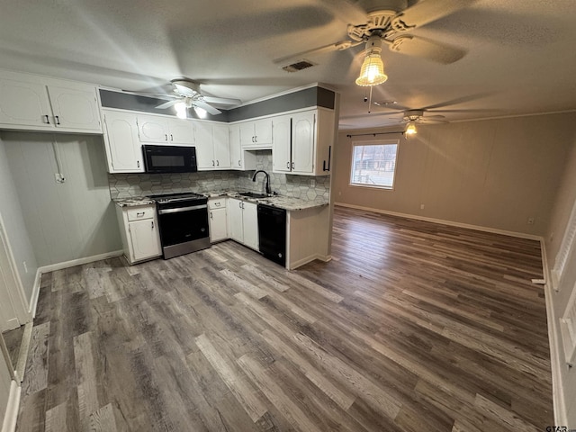 kitchen with white cabinets, a textured ceiling, decorative backsplash, and black appliances