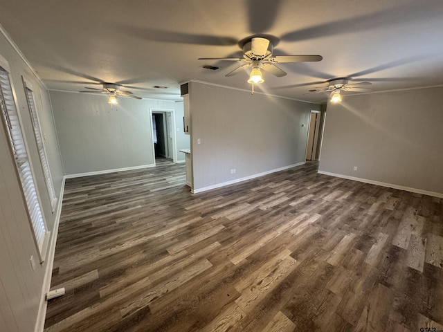 unfurnished living room with ceiling fan, ornamental molding, and dark hardwood / wood-style flooring