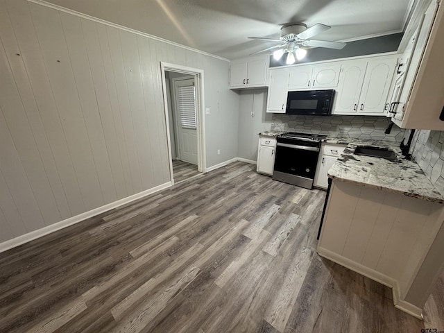 kitchen with sink, crown molding, electric range, light stone countertops, and white cabinets