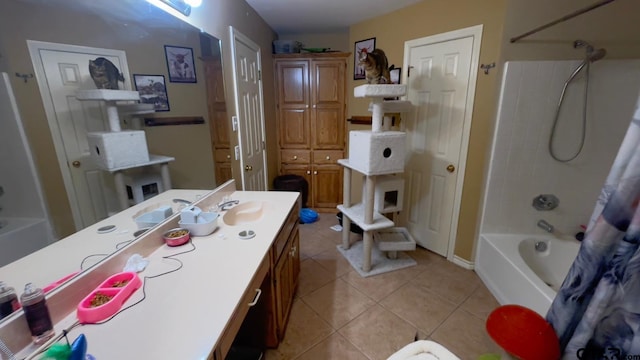 bathroom with tile patterned flooring, vanity, and shower / bath combo with shower curtain