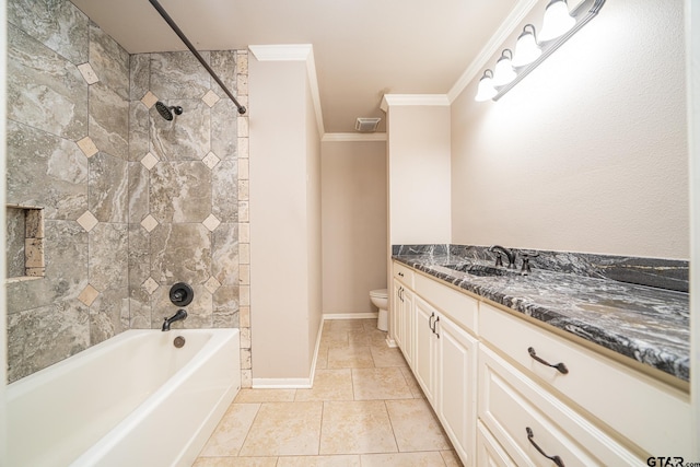 full bathroom with tiled shower / bath, tile patterned flooring, vanity, toilet, and crown molding