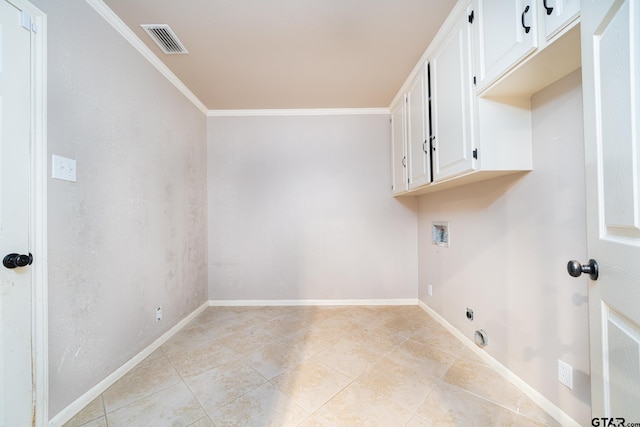 laundry room featuring washer hookup, crown molding, and cabinets