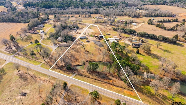 birds eye view of property with a rural view