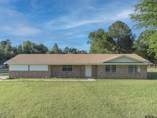 3803 Peavine Rd, Kilgore, TX 75662 - single story home with a front lawn and brick siding