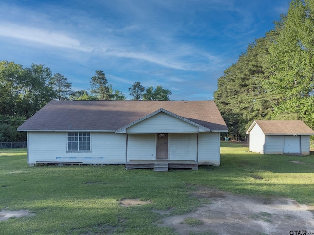 3803 Peavine Rd, Kilgore, TX 75662 - view of front of house with a front lawn and an outbuilding