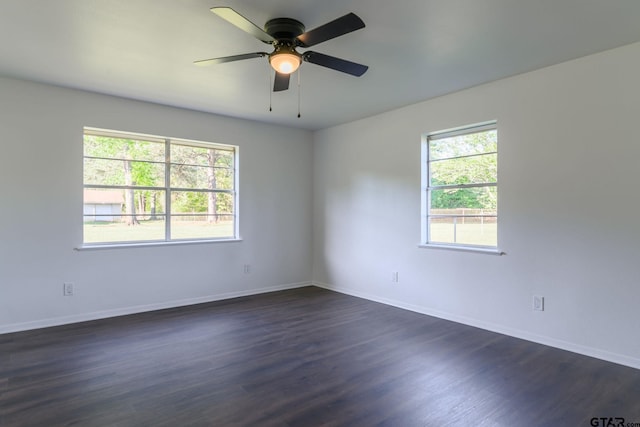 3803 Peavine Rd, Kilgore, TX 75662 - unfurnished room with dark wood-style flooring, baseboards, and ceiling fan