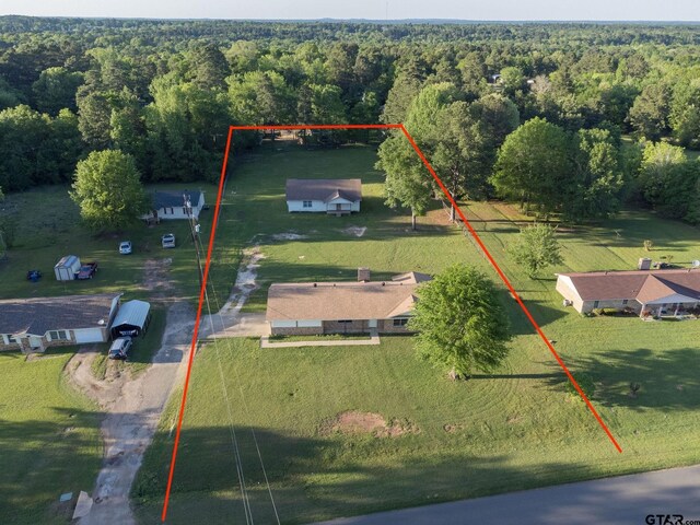 3803 Peavine Rd, Kilgore, TX 75662 - aerial view of property's location featuring a heavily wooded area and property parcel outlined