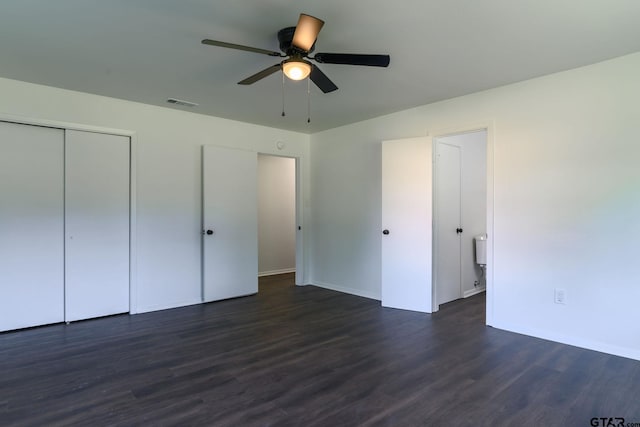 3803 Peavine Rd, Kilgore, TX 75662 - unfurnished bedroom featuring dark wood-style flooring, a closet, ceiling fan, and baseboards