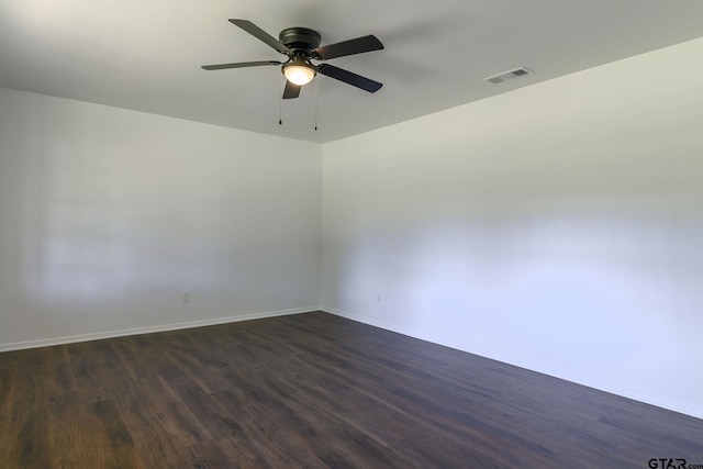 3803 Peavine Rd, Kilgore, TX 75662 - unfurnished room with dark wood finished floors, ceiling fan, and baseboards