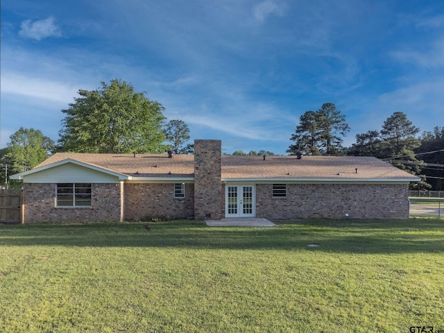 3803 Peavine Rd, Kilgore, TX 75662 - rear view of house with french doors and brick siding
