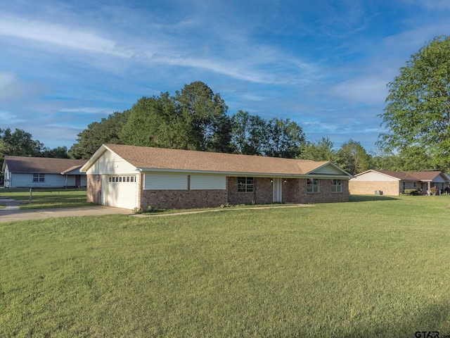 3803 Peavine Rd, Kilgore, TX 75662 - single story home featuring brick siding, a front lawn, an attached garage, and concrete driveway