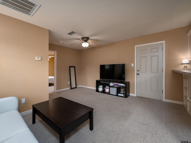 living room featuring light carpet and ceiling fan