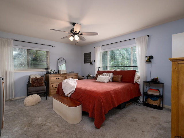 bedroom with light carpet and ceiling fan