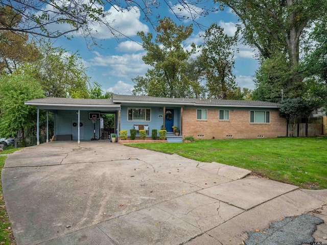 ranch-style home featuring a front lawn and a carport