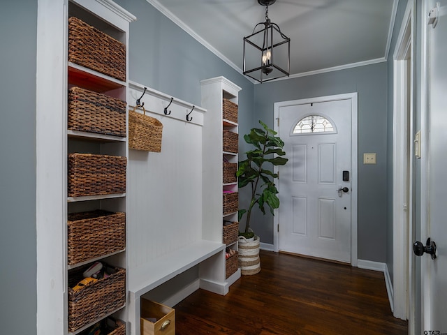 mudroom featuring crown molding, an inviting chandelier, and dark wood-type flooring