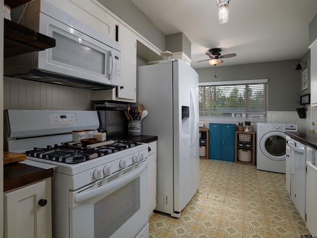 kitchen with blue cabinets, washer / dryer, white appliances, ceiling fan, and white cabinets