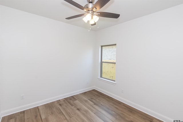 unfurnished room with light wood-type flooring and ceiling fan