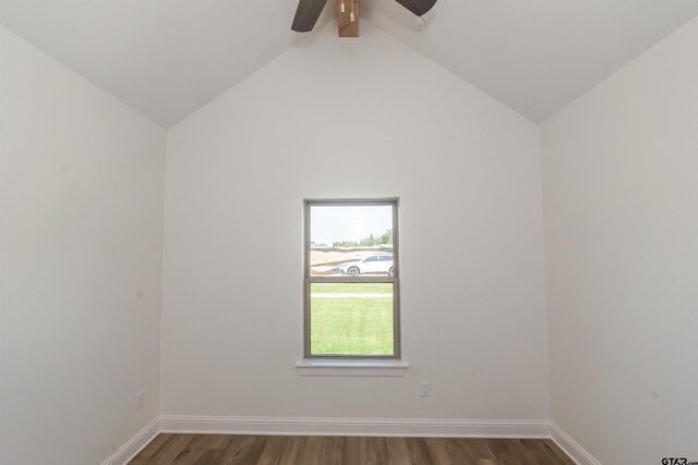 empty room featuring lofted ceiling with beams, dark hardwood / wood-style flooring, and ceiling fan