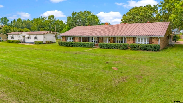 ranch-style house with a front lawn