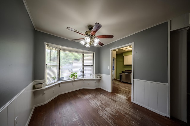 17550 Kristopher Cir, Whitehouse, TX 75791 - empty room with crown molding, wainscoting, ceiling fan, and dark wood-style floors