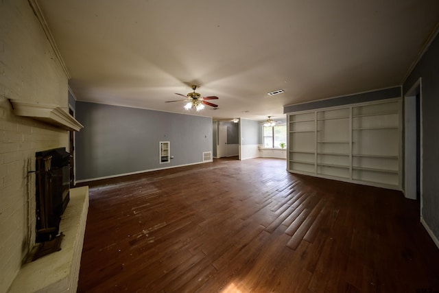 17550 Kristopher Cir, Whitehouse, TX 75791 - unfurnished living room featuring dark wood-type flooring, ceiling fan, ornamental molding, and a fireplace