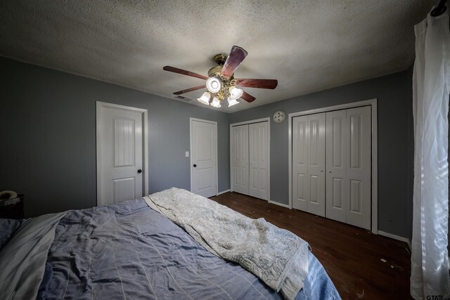 17550 Kristopher Cir, Whitehouse, TX 75791 - bedroom featuring wood finished floors, two closets, a ceiling fan, and a textured ceiling