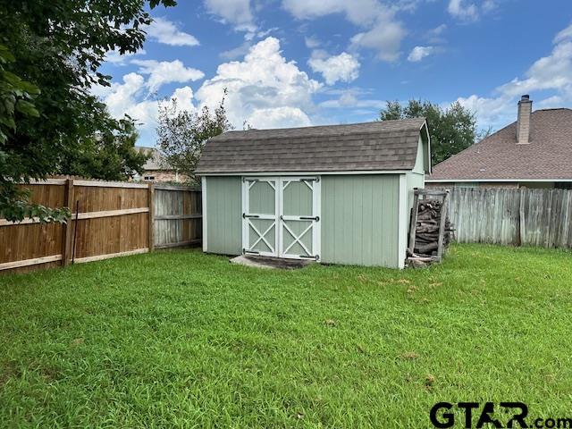 1712 Onyx Cv, Whitehouse, TX 75791 - view of shed with a fenced backyard