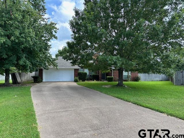 1712 Onyx Cv, Whitehouse, TX 75791 - view of property hidden behind natural elements featuring driveway