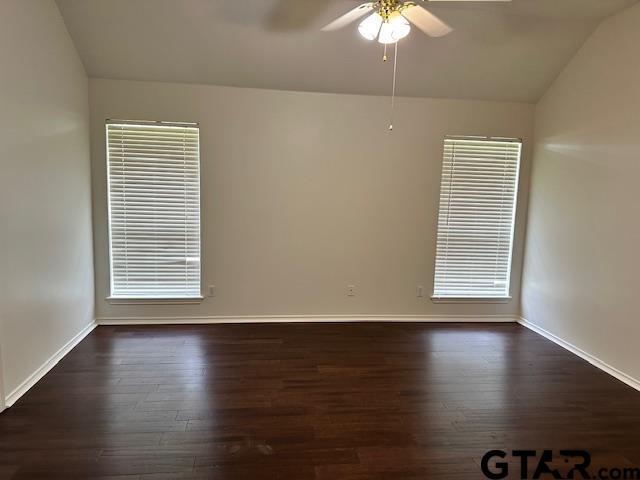 1712 Onyx Cv, Whitehouse, TX 75791 - empty room featuring vaulted ceiling, ceiling fan, and dark wood finished floors